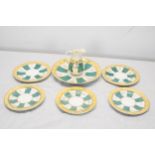 A hand painted 19th century green white and gold sunray pattern incomplete tea set. Largest plate