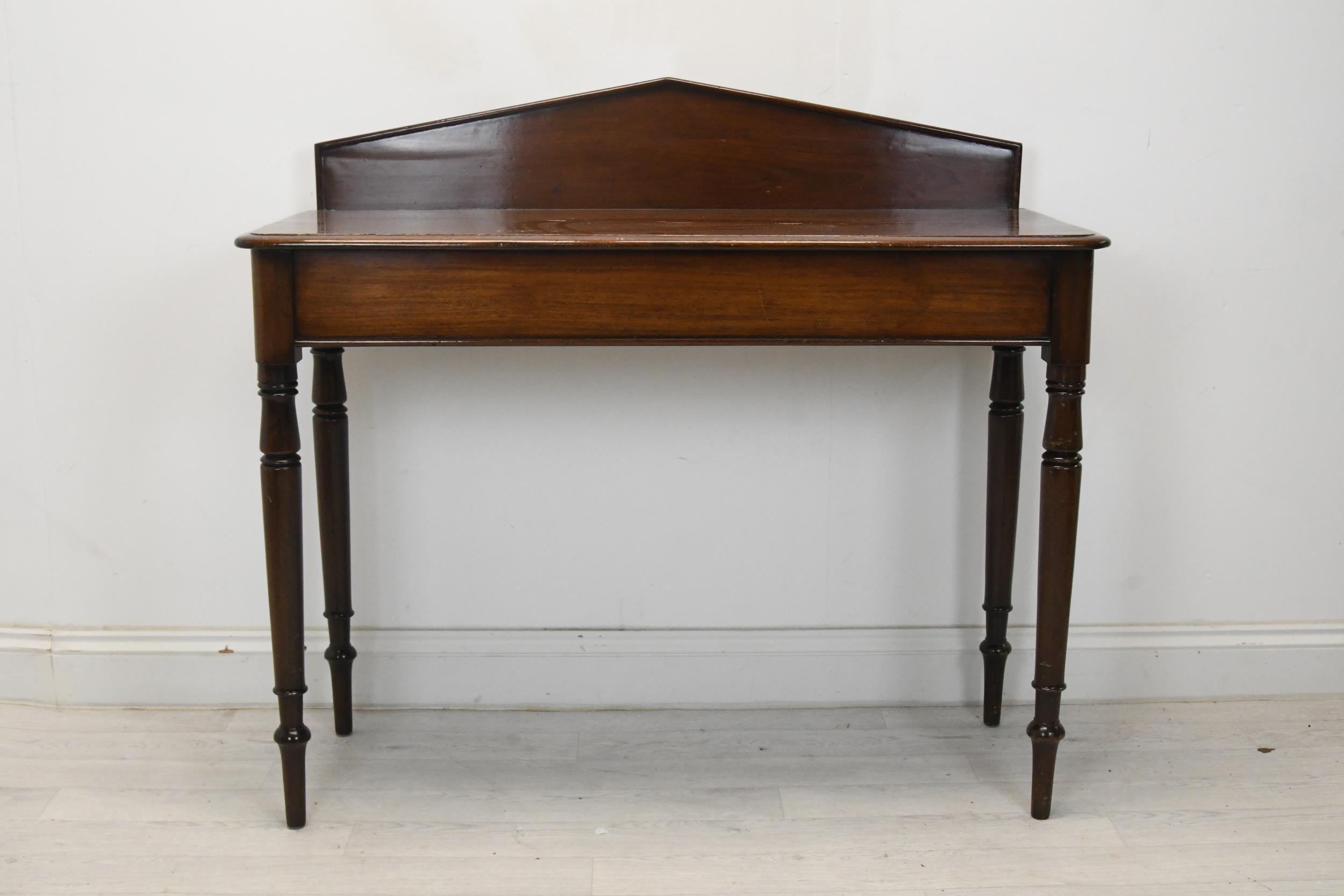 Console table, mid 19th century mahogany on turned supports. H.98 W.102 D.42 (Some damage as seen).
