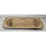 A hollowed wooden dough trough. H.120 W.40