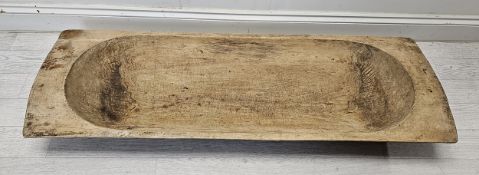 A hollowed wooden dough trough. H.120 W.40