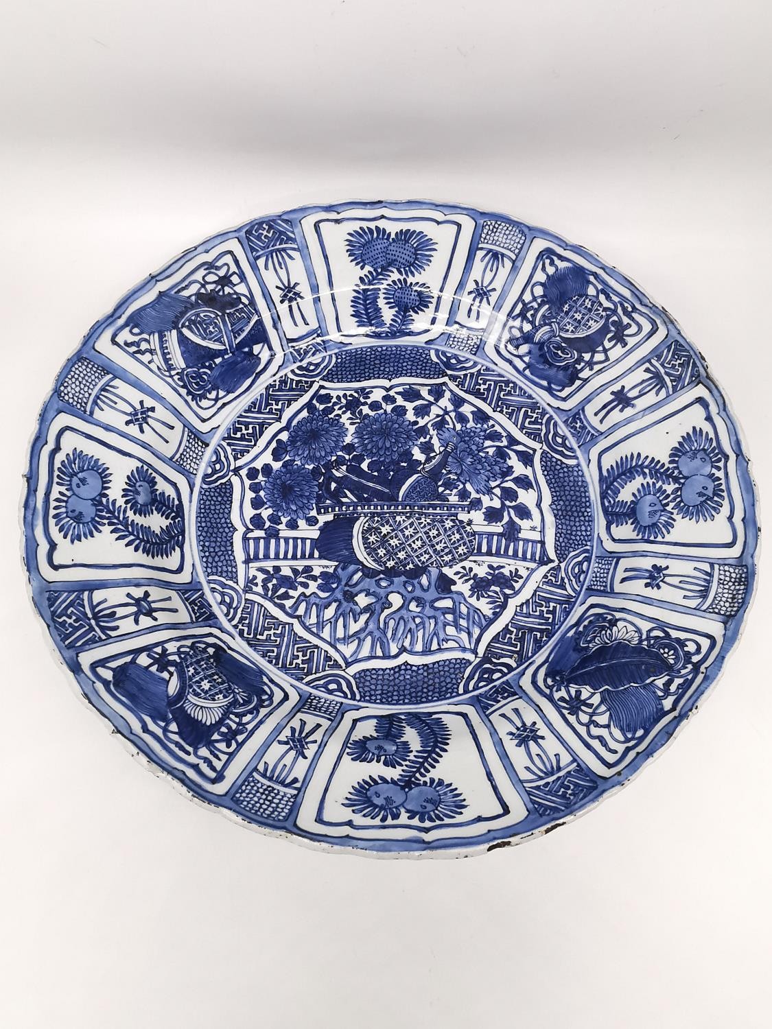 A very large Kangxi period Chinese Kraak blue and white charger decorated to its center with a