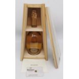 A limited edition 2013 Ruinart Champagne Brut bottle in reclaimed wood case designed by Piet Hein