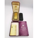 A collection vintage of gold plated lighters, including a cased gold plated Dunhill lighter with