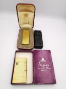 A collection vintage of gold plated lighters, including a cased gold plated Dunhill lighter with