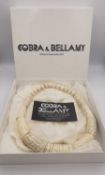 A boxed Cobra & Bellamy faux ivory statement necklace with barrel clasp.