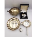 A collection of silver items, including two silver pill boxes, a silver floral form dish by Barker