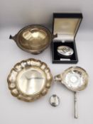 A collection of silver items, including two silver pill boxes, a silver floral form dish by Barker