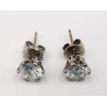 A pair of vintage 14ct white gold and diamond stud earrings, each earring set with a round brilliant