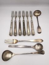 A collection of silver cutlery, including a set of six Georgian repousse dessert forks by