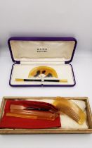 Two boxed and cased 1920s Japanese Kanzashi faux tortoiseshell and horn Kushi & Kogai sets. One with