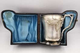 A fitted leather cased Victorian Martin Hall & Co carved sterling silver bramble design tankard. The