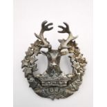 A Scottish Gordon Highland 1918 HM white metal (tests as silver) WWI officer Glengarry badge, with a