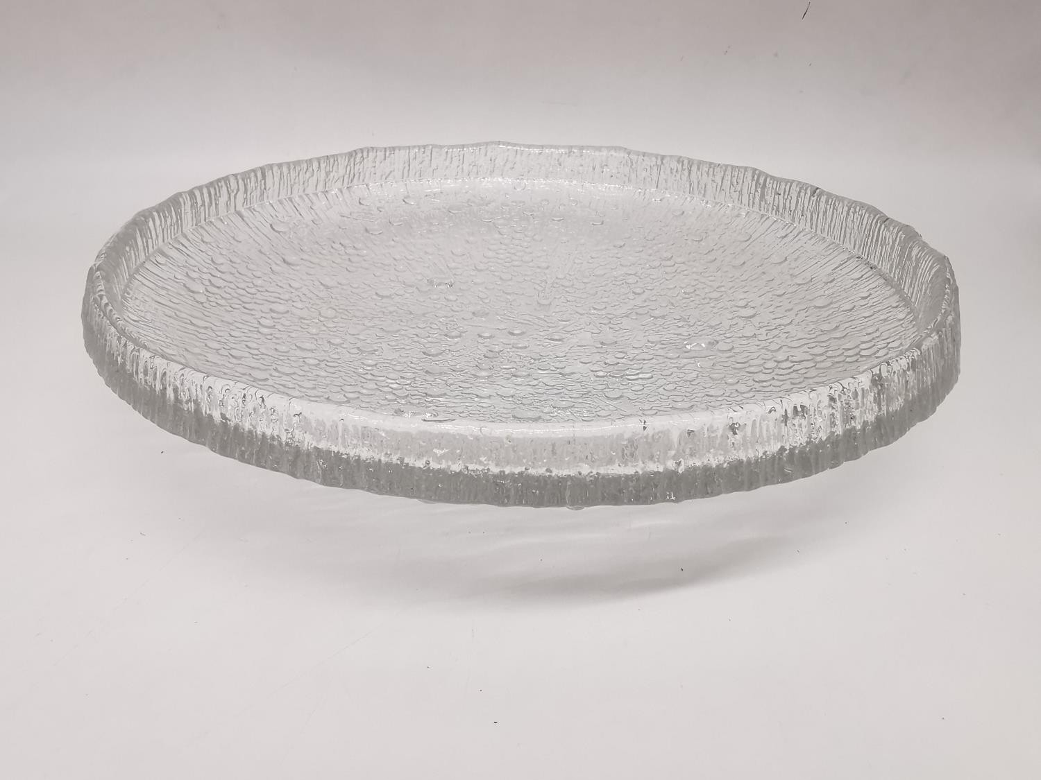 Tapio Wirkkala, Iittala - A post war Ultima Thule clear glass bowl of shallow circular form relief