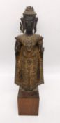 A 19th century Thai gilt bronze Buddha, in a intricately detailed and elaborate attire with both