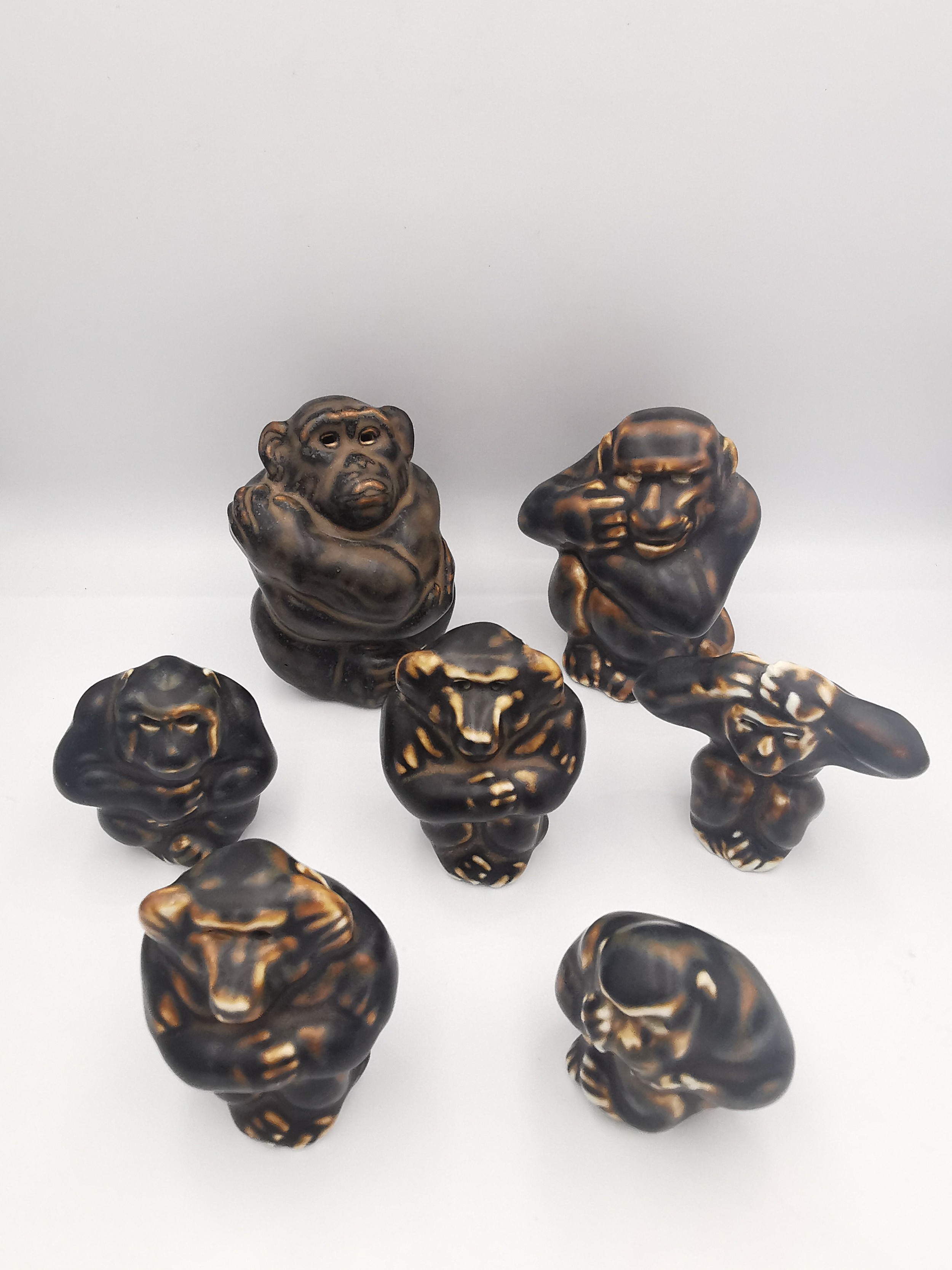 Knud Kyhn, Danish, (1880 - 1969). A collection of seven treacle glaze Royal Copenhagen stoneware