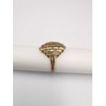 An abstract pierced design 9ct yellow gold dress ring. Hallmarked:375, Birmingham. Weight 1.90g Ring