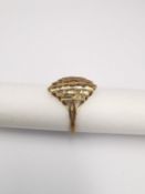 An abstract pierced design 9ct yellow gold dress ring. Hallmarked:375, Birmingham. Weight 1.90g Ring