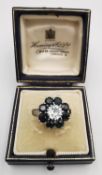 A boxed vintage sapphire and diamond platinum and 18ct white gold statement floral cluster ring. Set