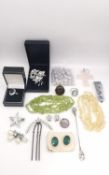 A collection of costume jewellery, including Citrine and peridot necklaces, a paste hat pin, a