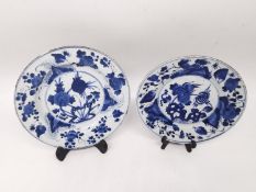 A pair of blue and white Kangxi period porcelain hand painted floral design plates. Double blue