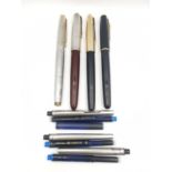 Four vintage four fountain pens, including a black Parker Sonnet with 18k gold nib, a vintage Parker