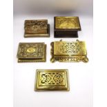 A collection of five 19th century and early 20th century brass stamp boxes, including one with a