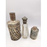 Three silver perfume bottles, one cut crystal with hinged silver repousse top set with turquoise and