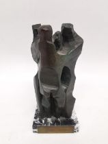 Merino Koldo, bronze sculpture of three embracing figures mounted on a black and white marble