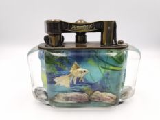 A 1950s Dunhill Aquarium lighter table lighter, shaped oval sections with intaglio underwater