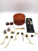 A leather boxed collection of shirt studs, cufflinks and a money clip, including a leather cased set