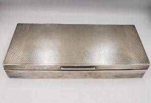 An Art Deco silver cedar lined cigarette box with three partitions. The lid with engine turned