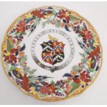 A 19th century Flight and Barr Worcester armorial ceramic plate, the ornate polychrome and gilt