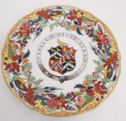 A 19th century Flight and Barr Worcester armorial ceramic plate, the ornate polychrome and gilt