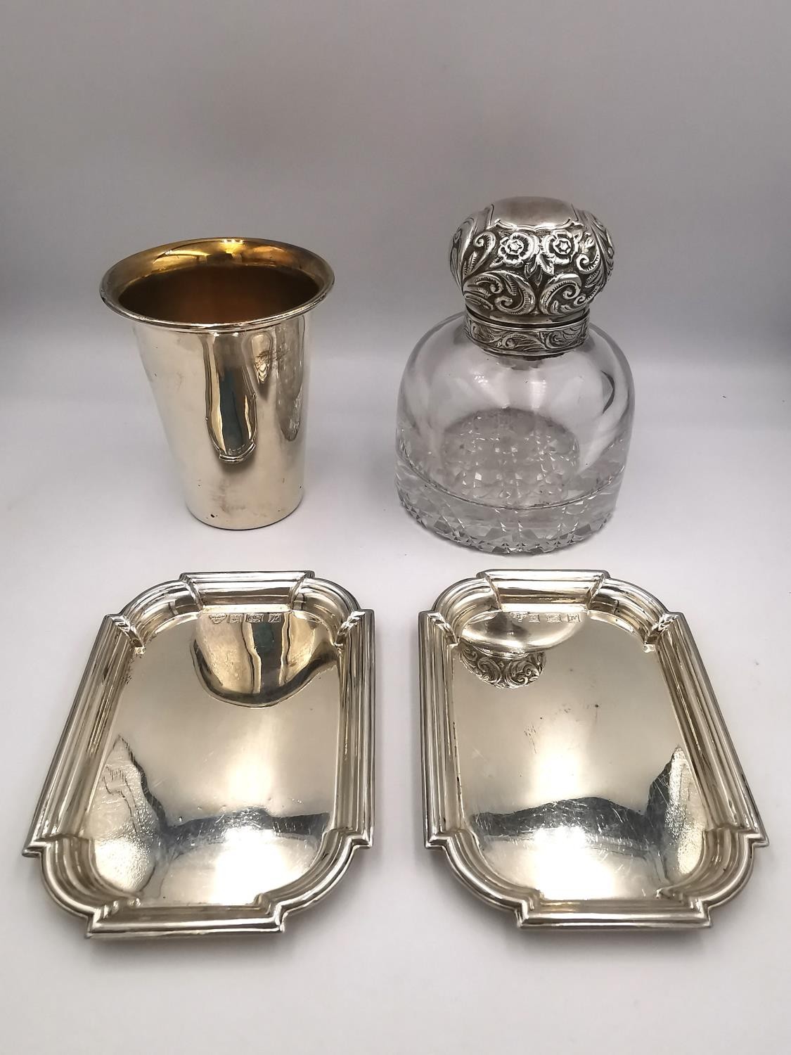 A collection of silver items, including a pair of Garrard & Co silver octagonal card trays, a silver