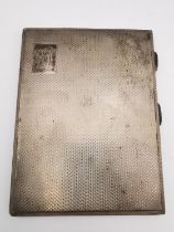 A 1940s silver cigarette case by Morgan & Boon with engine turned decoration and gilded interior.