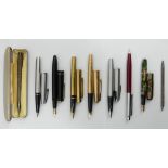 A collection of pens and pencils, including Parker and a Burnham marbled fountain pen along with two