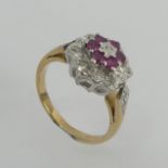 9ct gold ruby and diamond cluster ring, 3.1 grams. Size K, 11.7 mm. Uk Postage £12.