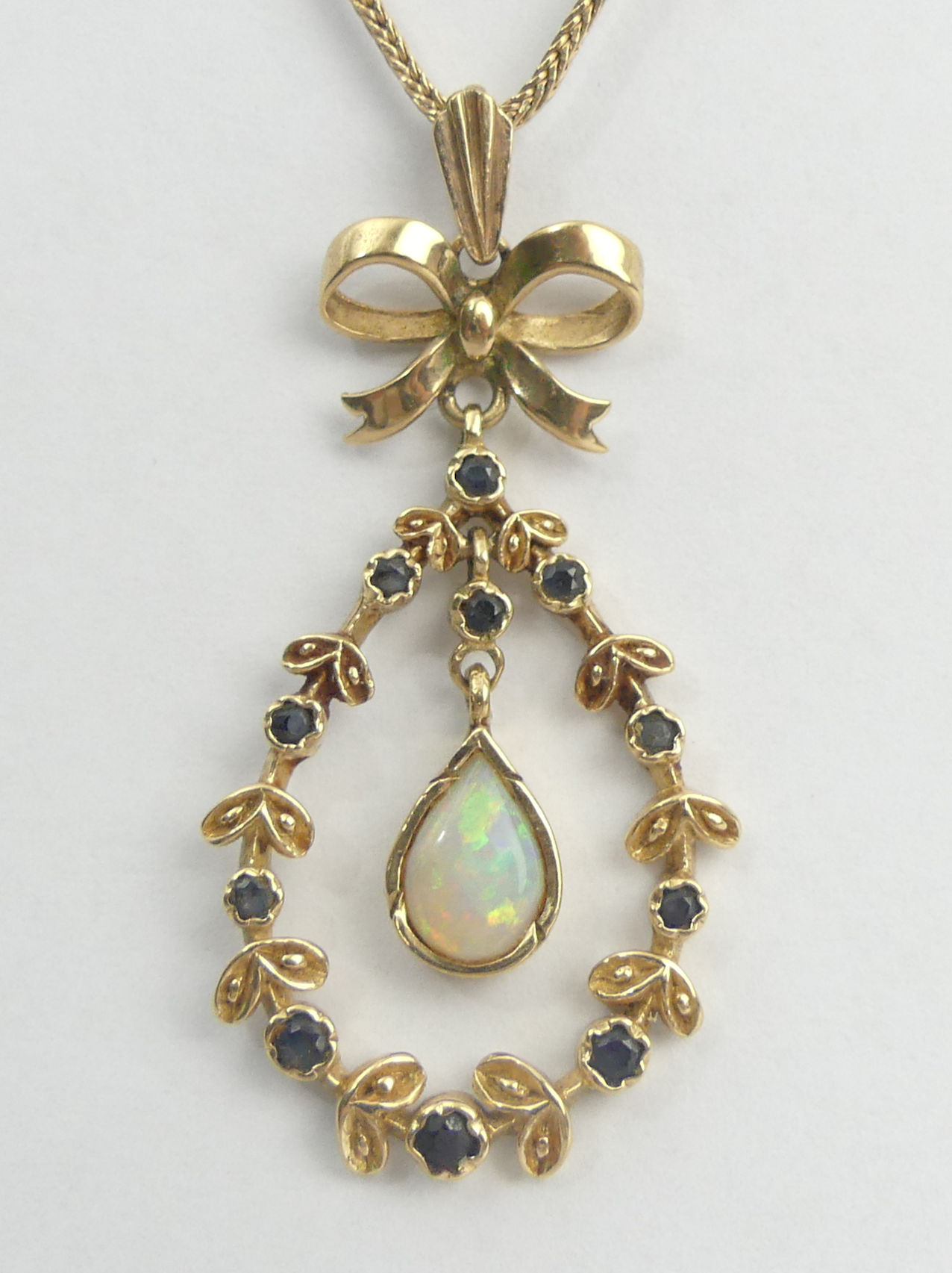 9ct gold sapphire and opal pendant and chain, 88 grams. Pendant 47 mm, chain 50 cm. UK Postage £12.
