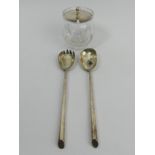 A pair of Mappin and Webb silver salad servers, Birm.1934 and a silver and glass preserve pot,