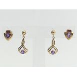 A pair of 9ct gold amethyst and garnet earring a pair of 9ct gold amethyst drop examples. 4 grams.