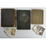 Two postcard albums and loose cards, along with a Victorian photograph album and contents. UK