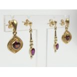 Two pairs of 9ct gold drop earrings, one pair set with garnets the other rubies, 5.7 grams. UK