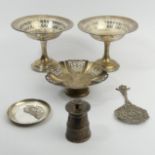 A pair of Edwardian silver comports, Sheffield 1910, a silver pepper mill, ornate silver spoon,