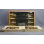 A display cabinet containing twelve pewter model cars and two Days Gone By display stands. 55 x 37