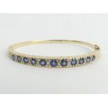 9ct gold sapphire and diamond hinged bangle, 14.4 grams. 5.4 mm at the widest point. Uk Postage £12.
