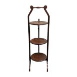 Edwardian mahogany inlaid folding cake stand. 89 cm high.