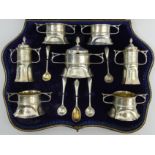 Arts and Crafts silver cased cruet set, London 1902, George Maudsley Jackson & David Lanesborough