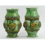 A Victorian pair of Castle Hedingham pottery medieval style vases, 20 cm. UK Postage £18.