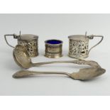 A pair of Victorian silver mustard pots, a George V silver salt, a Victorian silver sifter spoon and