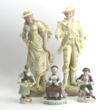 A pair of Victorian bisque figures, a French figure and two German porcelain figures. 36 cm. UK